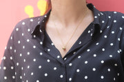 Sparrow BIrd Necklace on a simple blouse